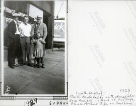 Matti Kantokoski (with bowtie) with daughter Eeva Annikki, in front of his café Prince Arthur Café, in Sudbury